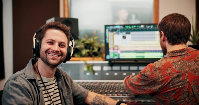 Production, music and face of producers with headphones in studio working on album or song with computer. Happy, equipment and male sound technicians with tech for mixing audio in recording booth.