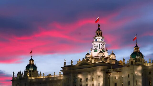 Grand Architectural Building with Clock Tower at Sunset