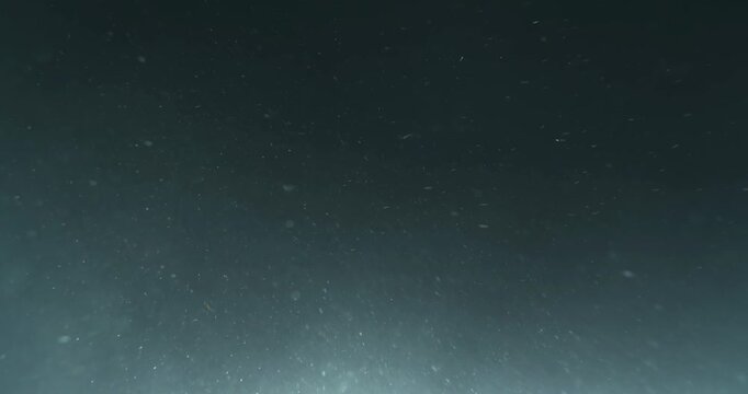 Cinematic 4K underwater footage captured from the POV of a deep-sea ROV drone, drifting through a vast, atmospheric water column filled with floating particles, soft light rays, and immersive depth&mdash;pe