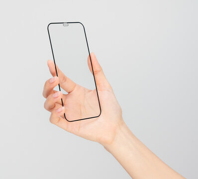 Clipping path, Gesture of hand holding smartphone with a blank screen, for mobile app mockup and digital technology concept.