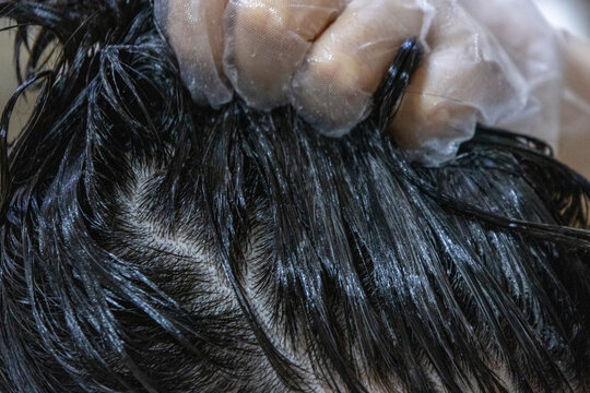 Close-up of the hair dyeing process