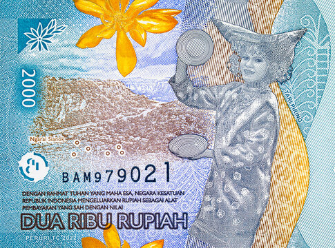2000 Rupiah Indonesia with a portrait of a girl dancing the national dance Tari Piring. New money of Indonesia.