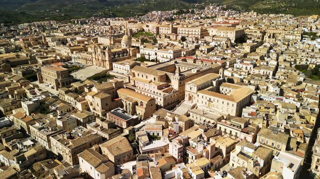 Aerial view of Nicolaci Palace and surrounding architecture in Noto, showcasing the intricate details of historic buildings and the vibrant layout of the cityscape
