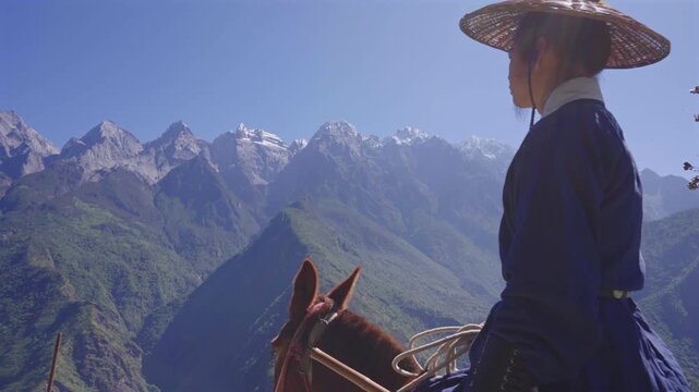 4K Cinematic Footage of Traditional Chinese Swordsman Journey Through Rugged Mountain Terrain
Ancient Chinese Martial Artist Traveling Through Snow-Capped Mountain Trails on Horse, Epic Wuxia Adventur