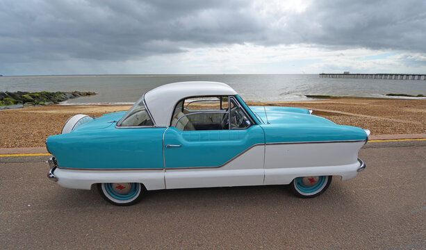 Vintage Blue and White Nash  Metropolitan Motor  Car Parked on Seafront Promenade.