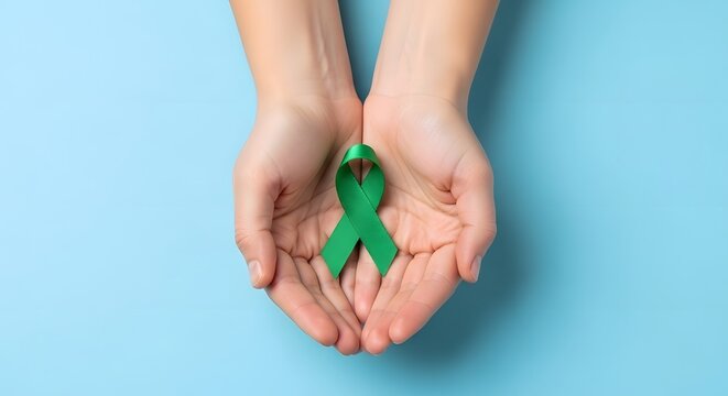 Hands cupping green ribbon symbolizing mental health awareness with well being