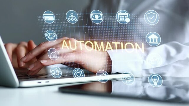 Working on automation technology with hands on laptop in office setting showing icons related to business and efficiency.