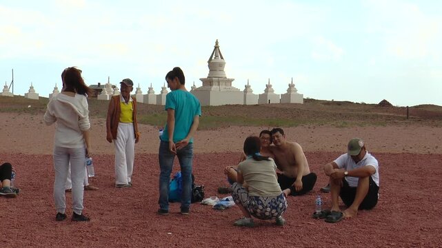 Mongolia, Sainshand - july 29, 2015: Tourists in the sacred Shambhala ritual complex in the Gobi desert. Summer cloudy day.