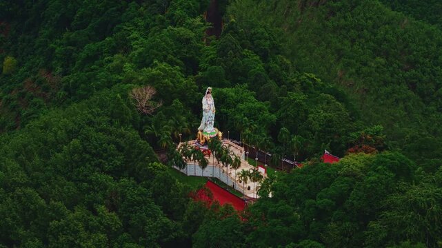 Wat Bang Riang temple in Khao Lan mountains of Phang Nga Province, Thailand aerial view. Compassion statue Kwan Yin Chinese Goddess.