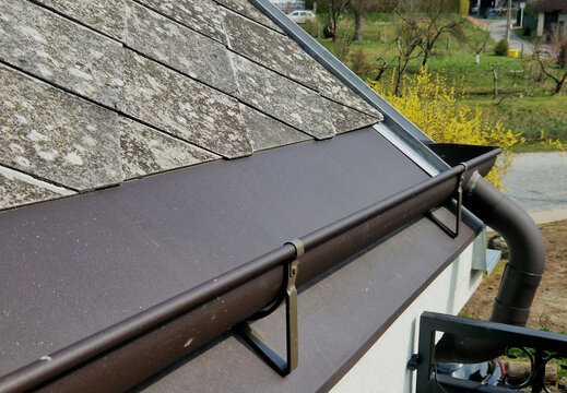 roof gutter, which is used to effectively drain rainwater from the roof and protect building foundation from moisture. gutter is attached to the shingle, eternit roof using hooks.