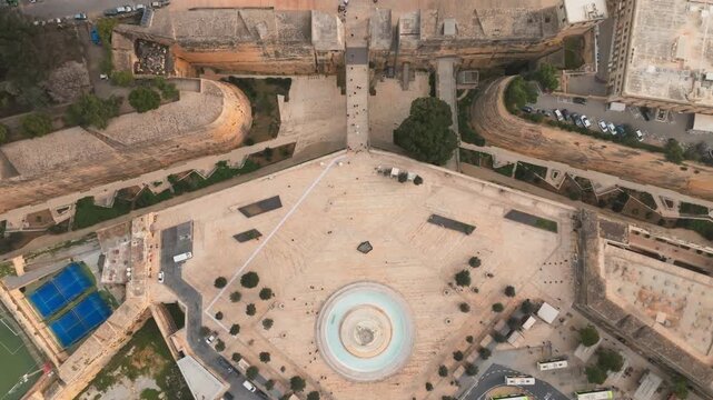 Valletta Drone old town revealing horizon, Aerial tilt up, Malta. Tritons fountain and city gates