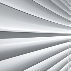 Obraz premium Close-up of white, angled blinds, casting shadows