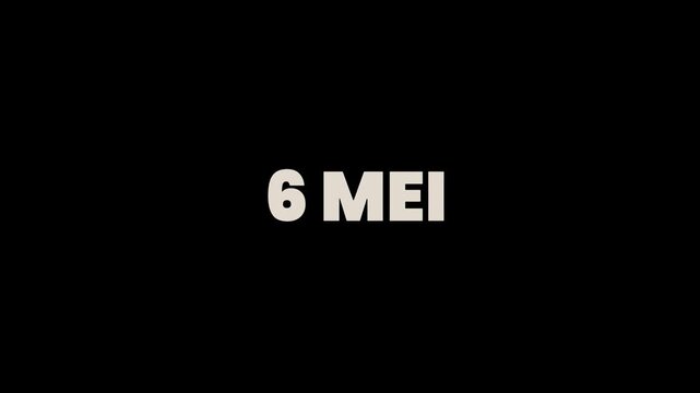 A sign reads 6 MEI on a black and white background