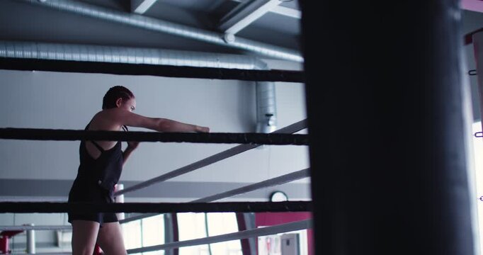 Focused on improving form and speed, this woman boxer uses shadow fighting drills to build endurance and refine her punch accuracy.