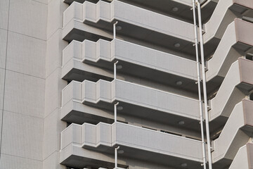 Close crop of white apartment balconies in repetitive pattern © Namsun