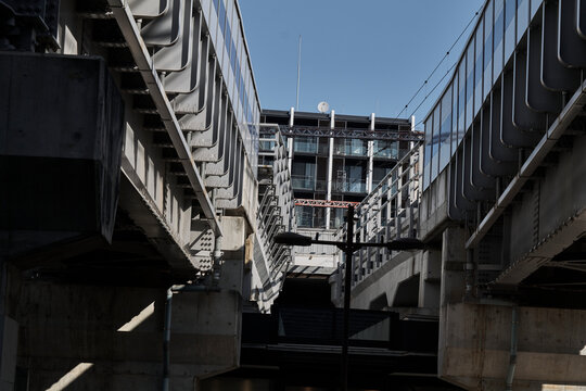 Elevated rail structure and underpass in dense city neighborhood