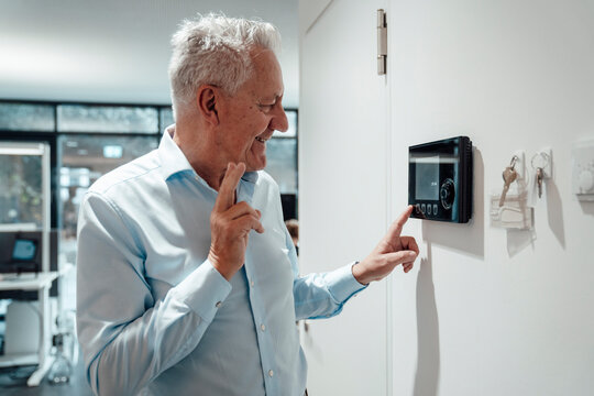 Boss operating security system in modern office