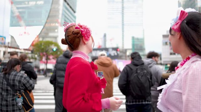 Two Young Women in Decora Fashion Talking on a Tokyo Street