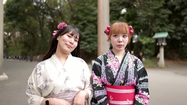 Two Japanese Women in Traditional Kimono Posing at Meiji Jingu Shrine