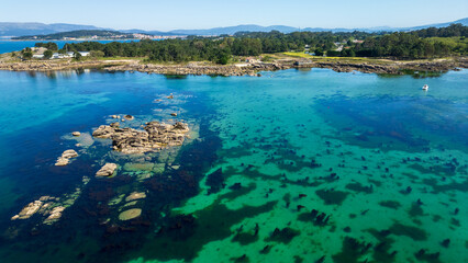 Fototapeta premium Aerial view of Carreirón Natural Park on Illa de Arousa, Spain