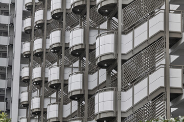 Abstract apartment facade crop with repeating circular balconies © Namsun