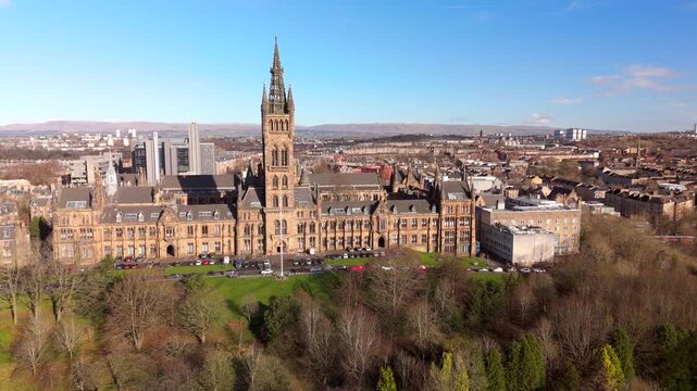 Drone view of Kelvingrove Park and Gilmorehill on a sunny golden hour winter morning in Glasgow Scotland