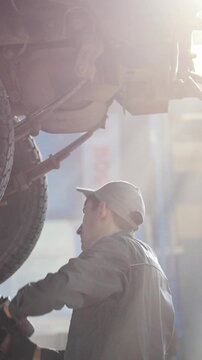Car automobile service - mechanic checks the luxury SUV, slider shot