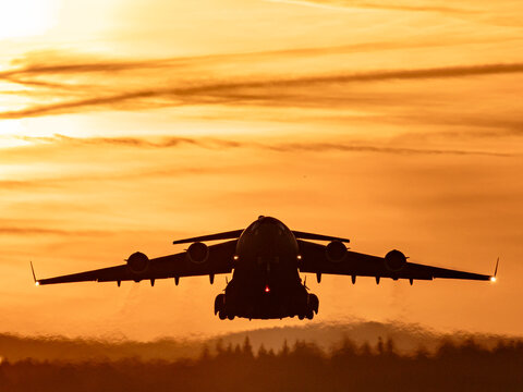 US Air Force Ramstein A C-17 Globemaster III takes off from Ramstein Air Base, engines roaring as the large military transport aircraft lifts into the sky. The scene highlights power, logistics, and m