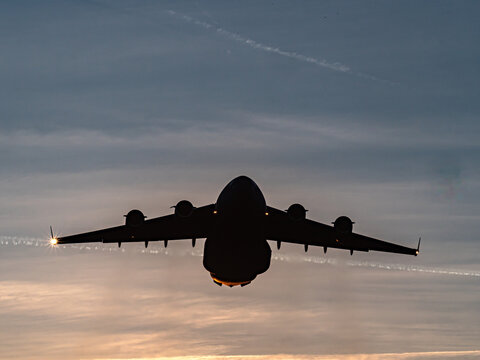 US Air Force Ramstein A C-17 Globemaster III takes off from Ramstein Air Base, engines roaring as the large military transport aircraft lifts into the sky. The scene highlights power, logistics, and m