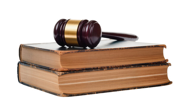 Dark wooden gavel resting atop stacked antique leather books