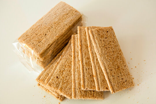 Whole grain snacks are stacked on a table