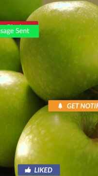 Vertical video: Green apples, mouse clicking Play badge causing social media badges engaging users