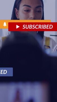 Male creator applying makeup with swab upon social popups appearing over face preparing for camera