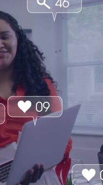 Vertical video: Woman holding laptop, blur sparking social media bubbles boosting engagement to 275