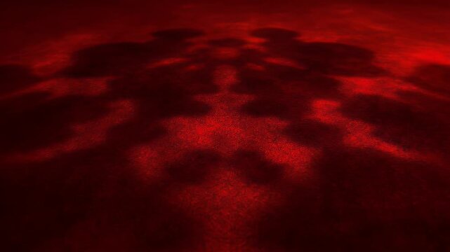 Abstract Red Light Reflections on Dark Surface Creating Dynamic Patterns and Shadows.
