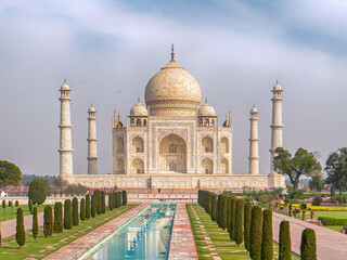 Fototapeta premium Agra, India, 20.02.20. Iconic white marble mausoleum with symmetrical garden