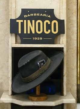 Barbeiro Tinoco 1929 vintage barbershop sign with hat display