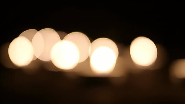 Abstract Bokeh Lights on Dark Background, Defocused Glowing Circles, Warm Light Effect, Blurry Night Illumination, Soft Focus Overlay, Dreamy Aesthetic, Gentle Glow, Luminous Backdrop, Subtle Light P.