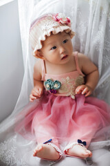 Fototapeta premium Cute Asian baby girl wearing a woolen hat