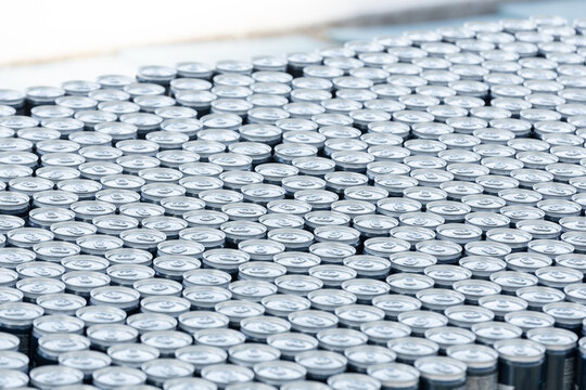 Stack of aluminum beer cans forming repetitive industrial