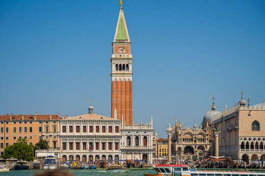 Venice, Italy - 29 March 2026: View of the iconic St. Mark's Campanile rising high above the historic skyline, its warm brick contrasting with the cool blue sky.