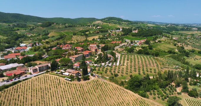 Rural Italy Tuscany aerial view vineyards hills landscape. Village rustic villas cypress trees nature background summer season sunshine beautiful destination tourism marketing content