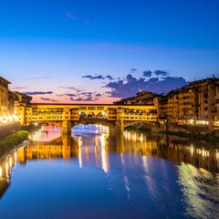 Obraz premium A serene river scene at dusk with a historic bridge and buildings