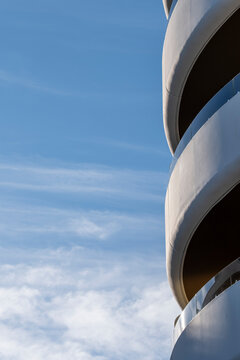 Abstract minimal architecture explores facade curvature as modern building meets sky where lines create contrast and calm geometric space
