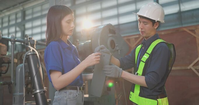 Entrepreneur explains custom DIY workpiece requirements to an engineer, reviewing parts, design options and prototype specifications in a workshop during development planning.
