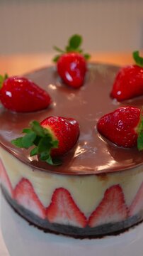 Vertical Macro Shot of Layered Cake with Strawberries and Chocolate Topping