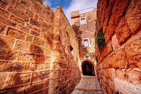 Traditional stone buildings in narrow street Old Jaffa, Tel Aviv, Israel.
