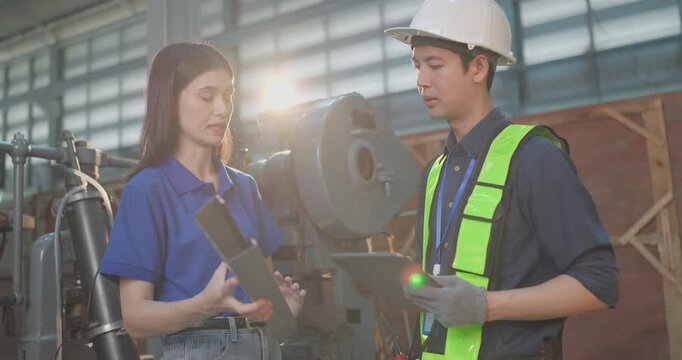 Entrepreneur explains custom DIY workpiece requirements to an engineer, reviewing parts, design options and prototype specifications in a workshop during development planning.
