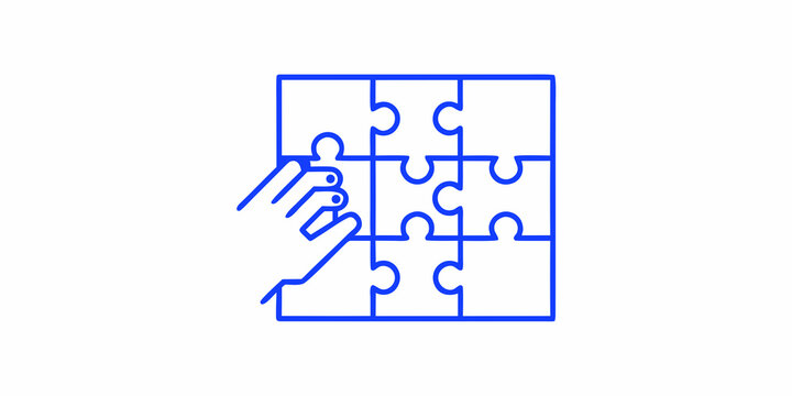 A hand inserting the final piece into a blue line puzzle