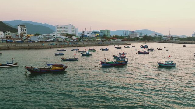 Aerial of traditional Vietnamese fishing boats with red flags at sunset, Nha Trang
traditional wooden fishing boats anchored in the Lang Chut area of Nha Trang, Vietnam